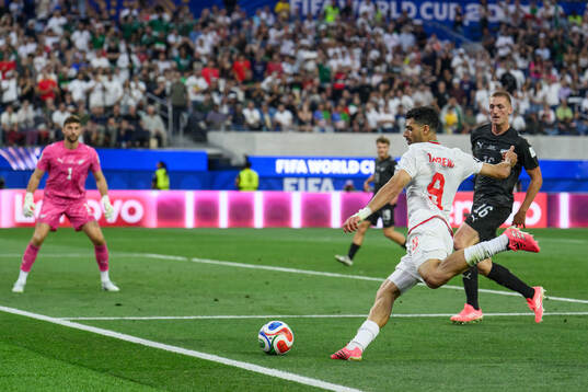 Mehdi Taremi of Iran against goalkeeper Max Crocombe and