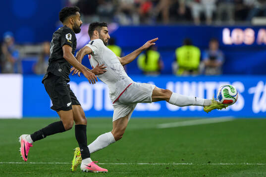 Sarpreet Singh of New Zealand and Milad Mohammadi of Iran