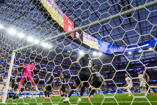 Goalkeeper Max Crocombe of New Zealand misses the ball