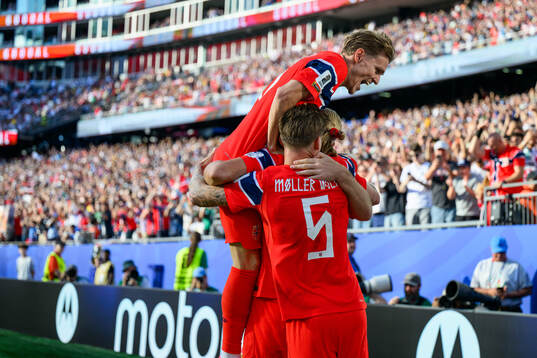 Martin Ødegaard of Norway celebrate with teammates