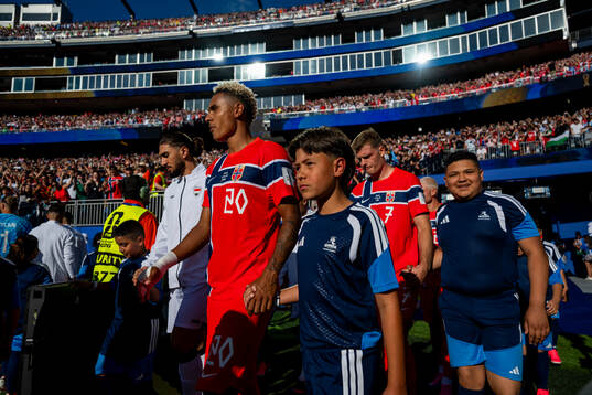 Antonio Nusa and Alexander Sørloth of Norway enter the