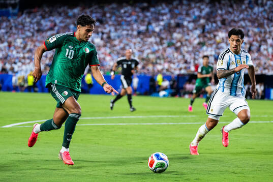 Fares Chaibi of Algeria and Thiago Almada of Argentina