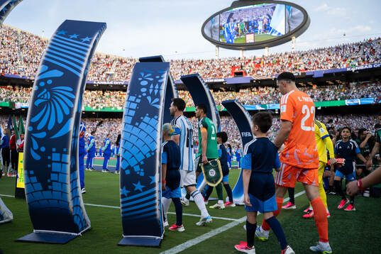Lionel Messi and goalkeeper Emiliano Martinez of Argentina