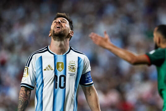 Lionel Messi of Argentina looks dejected