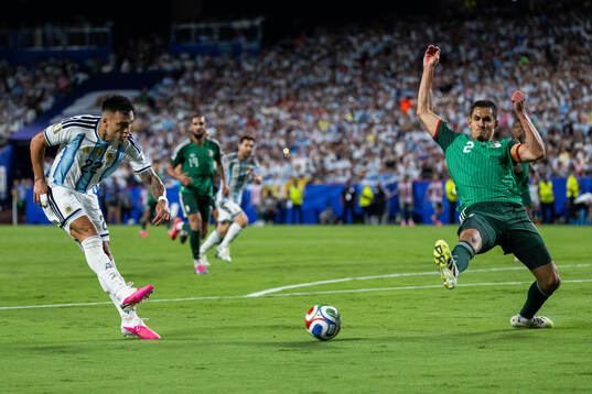 Lautaro Martinez of Argentina and Aissa Mandi of Algeria