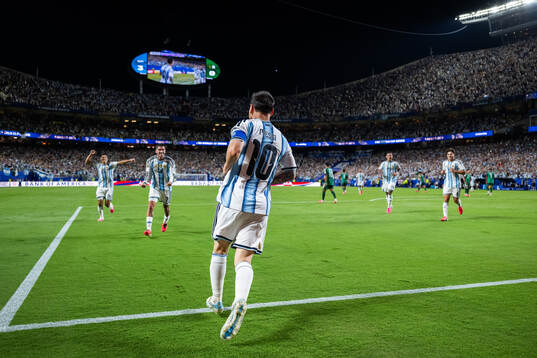 Lionel Messi of Argentina celebrates with teammates