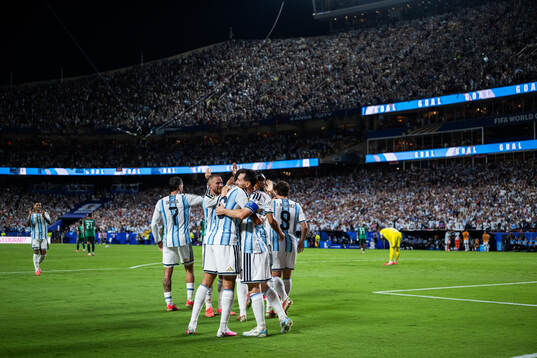 Lionel Messi of Argentina celebrates with teammates