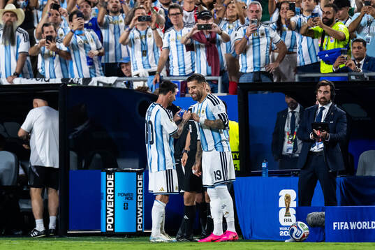 Lionel Messi and Nicolas Otamendi of Argentina