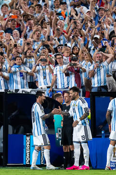 Lionel Messi and Nicolas Otamendi of Argentina