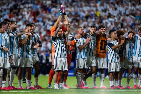 Lionel Messi of Argentina celebrates with teammates