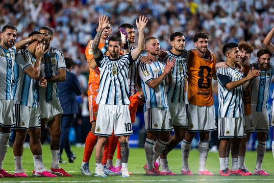 Lionel Messi of Argentina celebrates with teammates