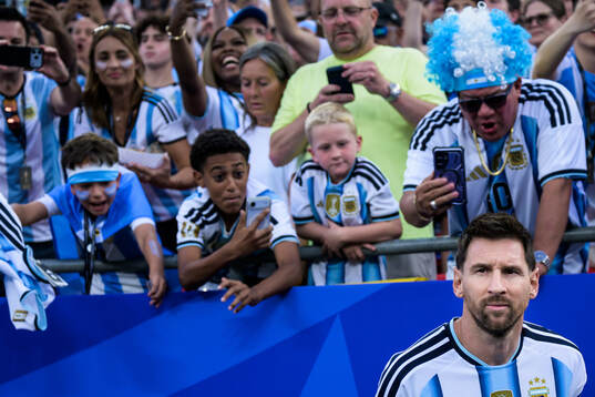 Lionel Messi of Argentina enters the pitch for the