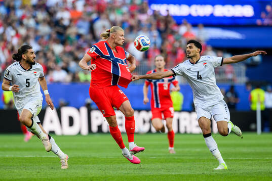 Erling Braut Haaland of Norway and Zaid Tahseen of Iraq