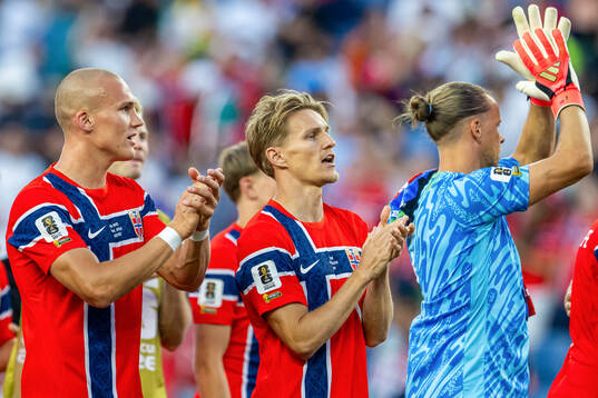 Martin Ødegaard and players of Norway celebrate