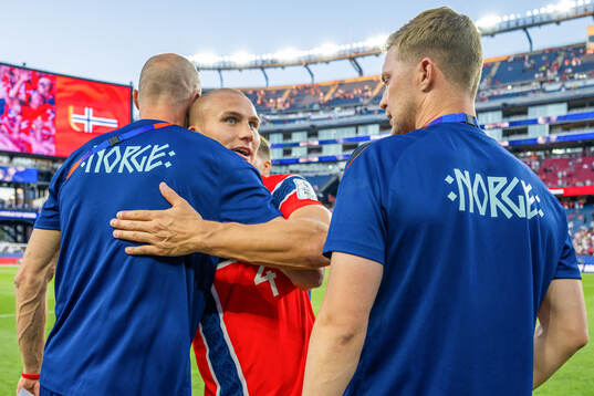 Leo Østigård of Norway celebrates with Brede Hangeland,