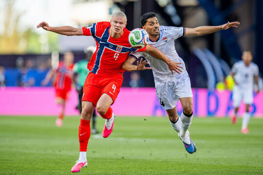 Erling Braut Haaland of Norway and Zaid Tahseen of Iraq