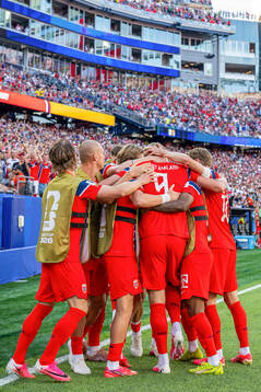 Erling Braut Haaland of Norway celebrates with teammates