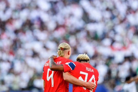 Erling Braut Haaland of Norway celebrates with teammate