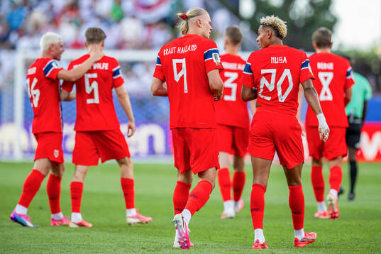 Erling Braut Haaland of Norway celebrates with teammate
