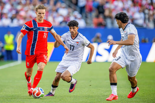 Martin Ødegaard of Norway and Ali Jasim Elaibi Al-Tameemi