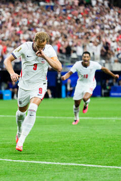 Harry Kane of England celebrates scoring 1-0