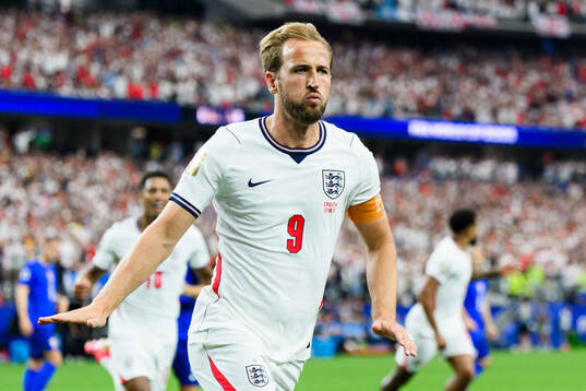 Harry Kane of England celebrates scoring 1-0