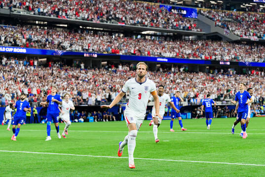Harry Kane of England celebrates scoring 1-0