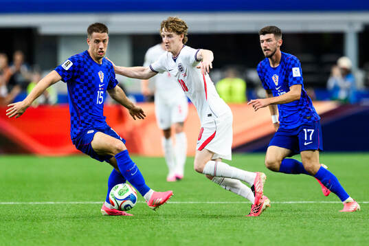 Mario Pasalic and Petar Sucic of Croatia and Anthony Gordon