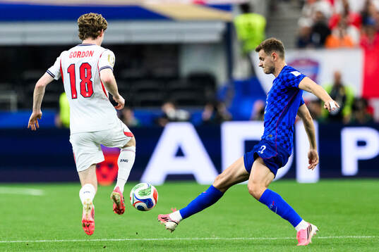 Anthony Gordon of England and Josip Stanisic of Croatia