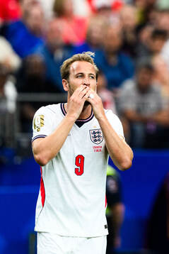 Harry Kane of England looks dejected
