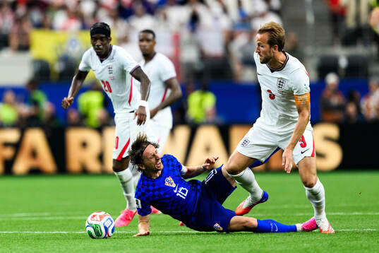 Luka Modric of Croatia and Harry Kane of England