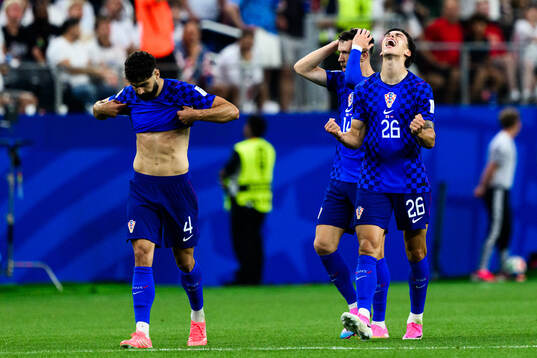Petar Musa of Croatia celebrates scoring 2-2
