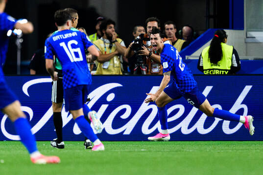 Petar Musa of Croatia celebrates scoring 2-2