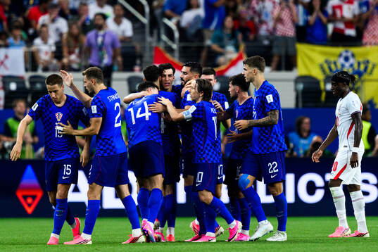 Petar Musa of Croatia celebrates scoring 2-2 with teammates