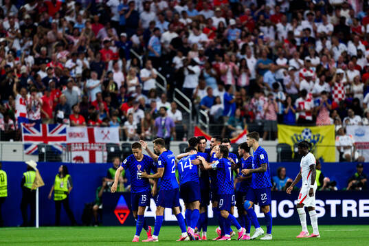 Petar Musa of Croatia celebrates scoring 2-2 with teammates