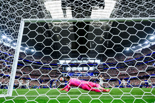 Goalkeeper Dominik Livakovic of Croatia saves a penalty