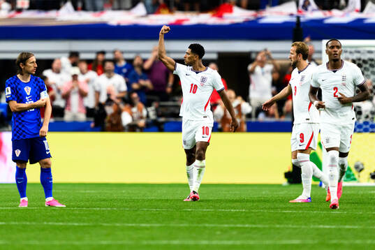 Jude Bellingham of England celebrates scoring 3-2
