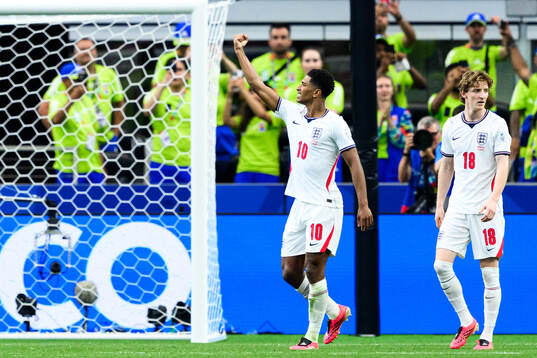 Jude Bellingham of England celebrates scoring 3-2