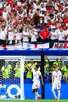 Jude Bellingham of England celebrates scoring 3-2