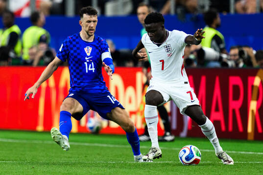 Ivan Perisic of Croatia and Bukayo Saka of England