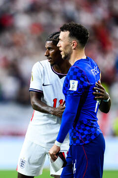 Marcus Rashford of England and Ivan Perisic of Croatia