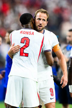 Ezri Konsa and Harry Kane of England