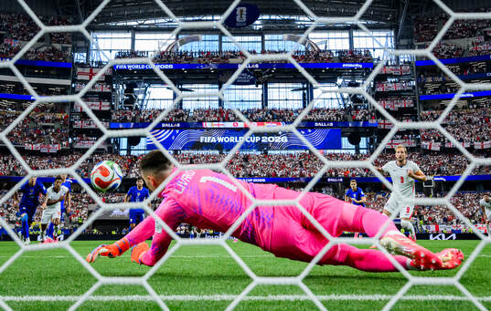 Goalkeeper Dominik Livakovic of Croatia saves a penalty