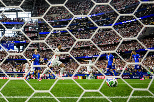Jude Bellingham and John Stones of England celebrate the