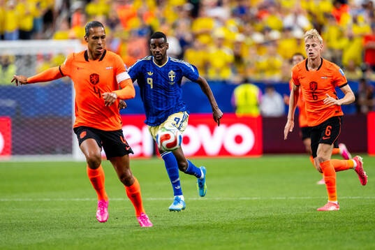 Alexander Isak of Sweden against Virgil Van Dijk and Jan