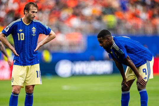 Benjamin Nygren and Alexander Isak of Sweden look dejected