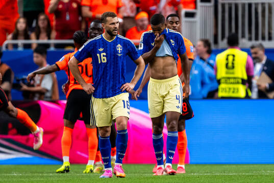 Jesper Karlström and Isak Hien of Sweden look dejected