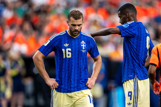 Jesper Karlström and Alexander Isak of Sweden look dejected