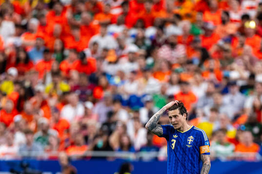 Victor Nilsson Lindelöf of Sweden looks dejected