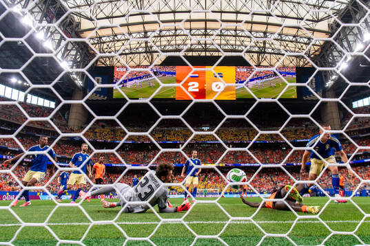 Cody Gakpo of Netherlands scores 3-0 behind goalkeeper